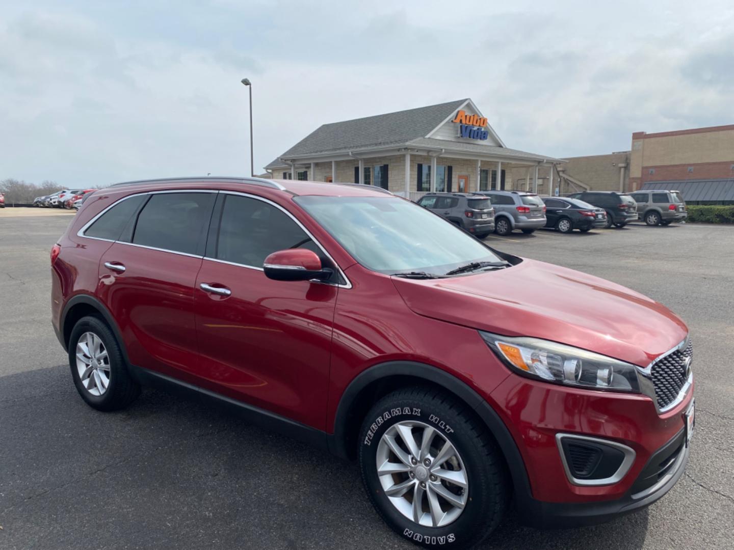 2016 RED Kia Sorento LX 2WD (5XYPG4A32GG) with an 2.4L L4 DOHC 16V engine, 6-Speed Automatic transmission, located at 420 I-35E, Lancaster, TX, 75146, (469) 297-4144, 32.593929, -96.823685 - Photo#0